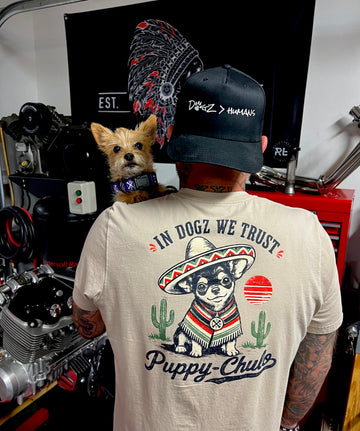 Puppy-Chulo Tee - In Dogz We Trust - Soft Cream - Back View - Male Model and Dog