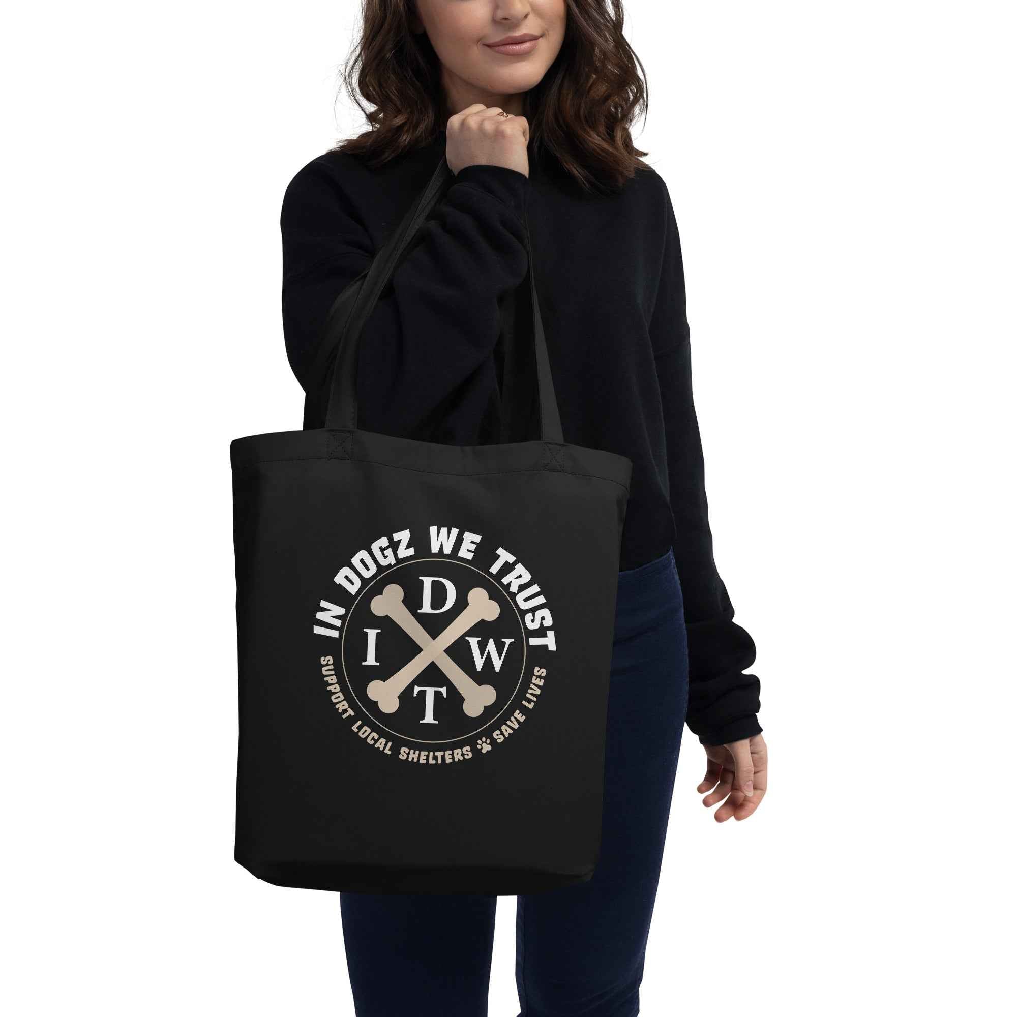Doggy Bag: Eco Tote - In Dogz We Trust Logo on Black Canvas Tote - Female Model - Front View